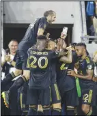  ?? Associated Press ?? Los Angeles FC defender Giorgio Chiellini jumps to celebrate with teammates after forward Kwadwo Opoku scored against the Seattle Sounders during the first half of an MLS soccer match, Friday, in Los Angeles. LAFC won 2-1.