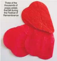 ??  ?? Three of the thousands of poppy petals that fell during the Festival of Remembranc­e