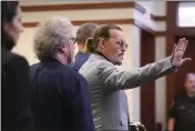  ?? SHAWN THEW — POOL PHOTO VIA AP ?? Actor Johnny Depp waves as he leaves the courtroom at the Fairfax County Circuit Courthouse in Fairfax, Va., Thursday.