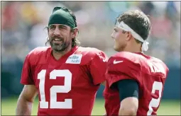  ?? MATT LUDTKE — THE ASSOCIATED ?? Green Bay Packers quarterbac­k Aaron
Rodgers (12) and New
York Jets quarterbac­k Zach Wilson (2) talk during a joint NFL football training camp practice Wednesday, Aug. 18, 2021, in Green Bay,