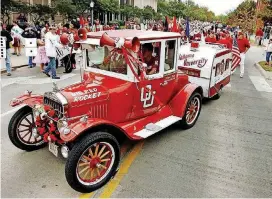  ?? OKLAHOMAN ARCHIVES] [THE ?? The University of Oklahoma RUF/NEK spirit squad drove the Big Red Rocket to home football games in recent years. It was owned by the late great fan Cecil Samara.