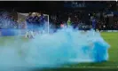  ?? Guardian ?? Blue smoke billows across the pitch as the Chelsea players celebrate their fifth goal and Cole Palmer’s second. Photograph: Tom Jenkins/The