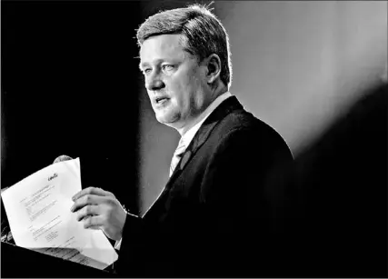  ?? J.P. MOCZULSKI/REUTERS ?? Conservati­ve Leader Stephen Harper addresses a combined meeting of the Empire and Canadian Clubs in Toronto yesterday. He criticized Liberal fundraisin­g methods over an event involving the Prime Minister in Toronto next week.