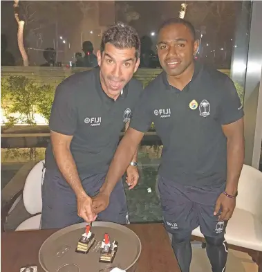  ??  ?? Fiji Airways Fijian 7s head coach Gareth Baber(left) and Waisea Nacuqu cut their birthday cake in South Korea on May 24,2018.