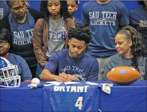  ?? ADAM SETTLE/SPECIAL to The Saline Courier ?? Bryant senior athlete Jordan Knox signs with the SAU Tech Rockets among family on Wednesday in Bryant.