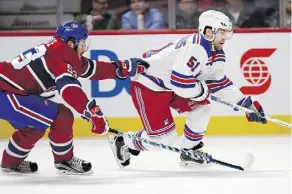  ?? ALLEN McINNIS ?? The Rangers’ David Desharnais, seen battling the Habs on Thursday night, says it’s “weird” but also exciting to return to Montreal.