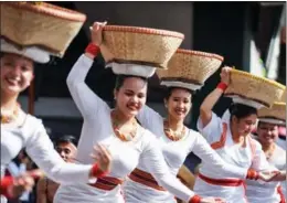  ?? ZHANG XINGLONG / CHINA NEWS SERVICE ?? Cultural dancers perform at a street dancing parade during the Panagbenga Festival in Baguio city, northern Philippine­s, on Feb 25. The annual event, also known as the Baguio Flower Festival, is held in February to usher in spring.