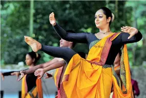  ??  ?? Yoga enthusiast­s; top and above; yoga in Kandyan dancing. Pix by Amila Gamage