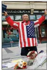  ?? AP/MICHAEL DWYER ?? Cristopher Nzenwa, of Boston, prays at the site of the first explosion during the 2013 Boston Marathon on Sunday. Today’s running of the Boston Marathon comes five years after the bombing.