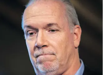  ?? THE CANADIAN PRESS/FILES ?? British Columbia Premier John Horgan has not withdrawn from the billion-dollar deal former premier Christy Clark signed with Kinder Morgan, notes Don Braid.