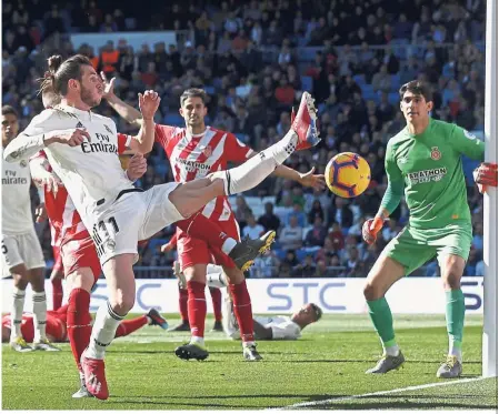  ?? — AP ?? Someone to rely on: Real Madrid’s Gareth Bale (left) trying to control the ball past Girona’s goalkeeper Yassine Bounou “Bono” during their La Liga match at the Bernabeu on Sunday.