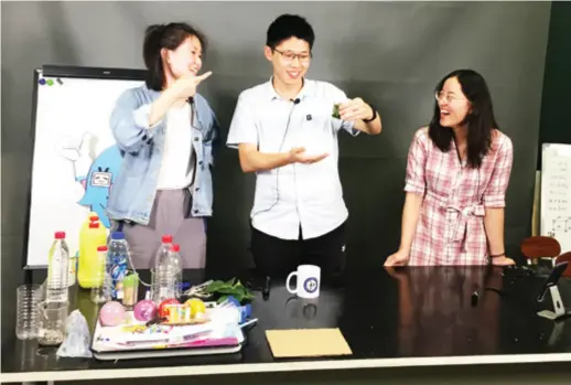  ??  ?? Liu Guangxiu (right) and Ji Yu (left), along with a team member, host a live-streaming show on Bilibili in Beijing on September 25