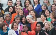  ?? SAUL LOEB / AFP ?? US Speaker of the House Nancy Pelosi (center left) takes a “selfie” with US Representa­tive Terri Sewell (center) as they stand with female House Democratic members of the 116th Congress for a photo outside the US Capitol in Washington, DC, on Friday.