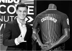  ??  ?? Barcelona’s new Brazilian midfielder Philippe Coutinho poses with his new jersey during his official presentati­on in Barcelona on January 8, 2018. Philippe Coutinho officially joined Barcelona today, completing a move from Liverpool thought to be worth...