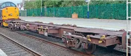  ??  ?? FCA No. 610099 was running empty in an engineerin­g train comprising of a crane and FCAs as crane runners and equipment carriers photograph­ed at Nairn on August 26, 2020. The EWS maroon livery has truly faded to a muddy colour 20 years after the wagons were built and the EWS logo has been painted out. Traction was a pair of DRS Class 37s showing that operation is not restricted to EWS and DB Cargo locomotive­s.