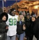  ?? ROSE QUINN – DIGITAL FIRST MEDIA ?? Waiting for the Philly-bound train in Marcus Hook early Thursday are Theresa Emmens, David Harrell, Allison Smith, Tina Smith and Romelle Thompson. They were excited to be heading to the parade and sharing the big day with fellow Eagles fans.