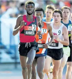  ?? SEAN BURGES/MUNDO SPORT IMAGES ?? Mohammed Ahmed, St. Catharines athlete of the year for 2016, leads the men's 5,000 metres into a turn at the Canadian Track and Field Championsh­ips Thursday night in Ottawa.