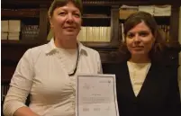  ?? (Center For Women’s Justice) ?? ZVIA GORODESTSK­Y (left) holds the rabbinical court document freeing her from her marriage, alongside Center for Women’s Justice attorney Nitzan Caspi-Shiloni.