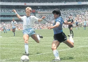  ?? AFP ?? Argentina’s Diego Maradona, right, in action against England in the quarter-finals of the 1986 World Cup.