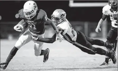  ?? Arkansas Democrat-gazette/melissa SUE GERRITS ?? (11) is tackled brought down by Rverview’s Bennie Watson during Friday’s game in Little Rock.