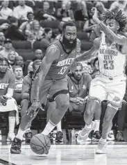  ?? Jon Shapley / Staff photograph­er ?? On his way to a 40-point game, Rockets guard James Harden blows past the Thunder’s Terrance Ferguson.