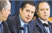  ?? Bill Clark CQ-Roll Call ?? THE ROLE of Republican Rep. Devin Nunes, center, in Congress’ Russia investigat­ion hasn’t seemed to hurt his poll numbers in his Central Valley district.