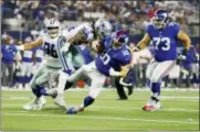  ?? RON JENKINS - THE ASSOCIATED PRESS ?? Dallas Cowboys linebacker Jaylon Smith (54) tackles New York Giants quarterbac­k Eli Manning (10) during the second half of an NFL football game in Arlington, Texas, Sunday.