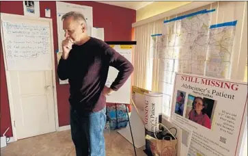  ?? Genaro Molina Los Angeles Times ?? KIRK MOODY, husband of Alzheimer’s patient Nancy Paulikas, uses maps and posters during his search.