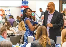  ?? Chris Torres/The Signal ?? Kim Humphries from the Saugus Union School District, left, speaks with Tim Langford of the Newhall School District, right, during the SCV Education Foundation’s Teacher Tribute Event at the Canyon Country Community Center in Canyon Country