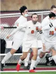  ?? MIKE MANTUCCA/DAILY SOUTHTOWN ?? Shepard’s Adam Critchett (8) celebrates with teammates after scoring a goal against Argo during a game in Summit on Monday.