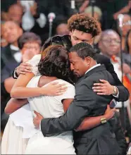  ?? PAUL SANCYA/AP PHOTO ?? Family members, clockwise from foreground left, Cristal Franklin, Victorie Franklin, Jordan Franklin and Vaughn Franklin embrace during the funeral for Aretha Franklin at Greater Grace Temple on Friday in Detroit. Franklin died Aug. 16 of pancreatic cancer at age 76.