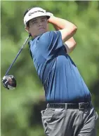  ?? GETTY IMAGES ?? Beau Hossler hits his tee shot on the 15th hole en route to a second-round 68 Friday at the Golf Club of Houston.