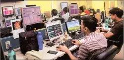  ?? PTI ?? Brokers watch stock prices in Kolkata on Friday.