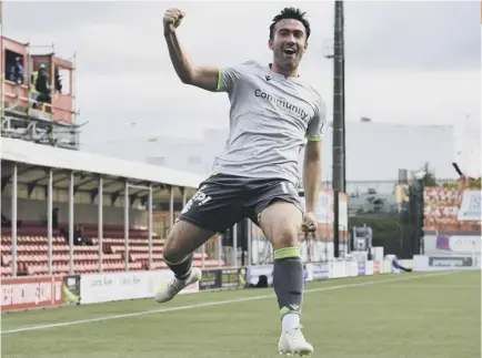  ??  ?? 2 Stevie Mallan celebrates his first-half volley, putting Hibs in front, but his foul gave Accies the penalty which drew them level.