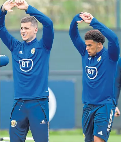  ??  ?? Hands up if you can score against Israel. Lyndon Dykes and Che Adams, seen in training, will be hoping Eran Zahavi (inset) won’t be celebratin­g at Hampden again