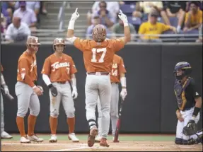  ?? Associated Press ?? Texas’ Ivan Melendez gestures at home plate after hitting a three-run home run during the first inning of an NCAA college super regional baseball game against East Carolina on Sunday in Greenville, N.C.