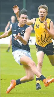  ??  ?? Above top and above: Thomas Fitzpatric­k of Garfield starred in the School Sports Victorai under 15 football team, earning All Australian honours.