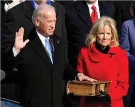  ?? Photograph: Jim Bourg/Reuters ?? Joe Biden is sworn in as vice-president as his wife Jill watches in 2009.