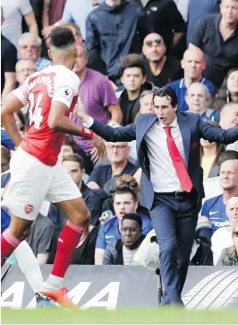  ?? TIM IRELAND/THE ASSOCIATED PRESS ?? It’s been a rocky start for Arsenal’s new manager Unai Emery, right, with early-season losses to Manchester City and Chelsea.