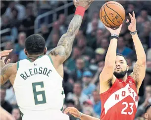  ?? FRANK GUNN THE CANADIAN PRESS FILE PHOTO ?? Raptors guard Fred VanVleet, seen here shooting over Milwaukee Bucks guard Eric Bledsoe in Game 5 of the NBA Eastern Conference final, made seven three-pointers in that game.