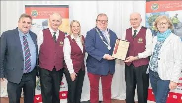  ?? (Pic: Brian Lougheed) ?? Seamus Aherne of Fermoy Concert Band, accepting a certificat­e to mark their nomination in the 2023 Mayor’s Awards, from the Mayor of the County of Cork, Cllr. Danny Collins. Also included are band members Phil Dunphy, Karen Roche and Lisa Dunphy, with Cllr Noel McCarthy.