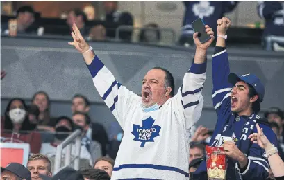  ?? STEVE RUSSELL PHOTOS TORONTO STAR ?? Everyone in the crowd was happy to be “getting back to normal,” Emma Teitel writes, but nearby bars still have capacity limits.