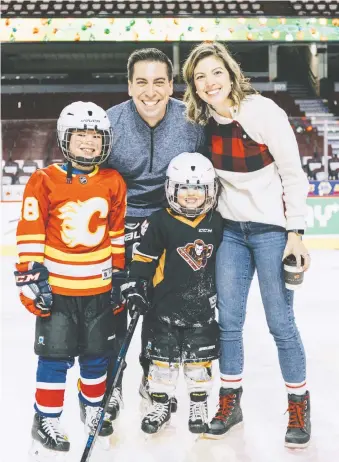  ??  ?? Flames assistant GM Chris Snow enjoys a skate last Christmas at the Saddledome with wife Kelsie, son Cohen and daughter Willa. Chris is still chasing his kids around today, something his doctor predicted wouldn’t be possible.