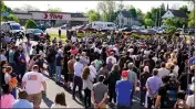  ?? MATT ROURKE — THE ASSOCIATED PRESS ?? People gather outside the scene of a shooting at a supermarke­t in Buffalo, N.Y., on Sunday.