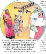  ?? Picture: AP Photo/Rajesh Kumar Singh ?? A health worker (right) persuades a village woman, Maju Kol (left) to get vaccinated against the coronaviru­s at Jamsoti Village, Uttar Pradesh state, India.