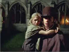 ??  ?? Hugh Jackman, seen here holding Isabelle Allen in Les Misérables, will be at Universal’s Golden Globes supper party tonight at Spago.