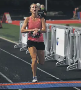  ?? PAUL DICICCO — FOR THE NEWS-HERALD ?? Emily Akin, a junior on the Miami of Ohio track and cross country team, was the women’s winner at the Friday Night Lights race in Mentor on July 24.