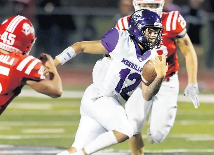  ?? JOHN SMIERCIAK/POST-TRIBUNE PHOTOS ?? Merrillvil­le quarterbac­k Angel Nelson finds a hole during the game at Crown Point on Friday.