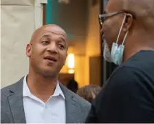  ?? AMAnDA sAbgA / boston HerAlD ?? John Barros chats with attendees at a meetup hosted by Boston Wealth Builders at The Pearl restaurant.