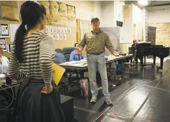  ?? Beck Diefenbach / Special to The Chronicle ?? TheatreWor­ks Artistic Director Robert Kelley (right) visits with actors during rehearsal for “Daddy Long Legs” in Redwood City. Kelley founded the theater company in 1970.